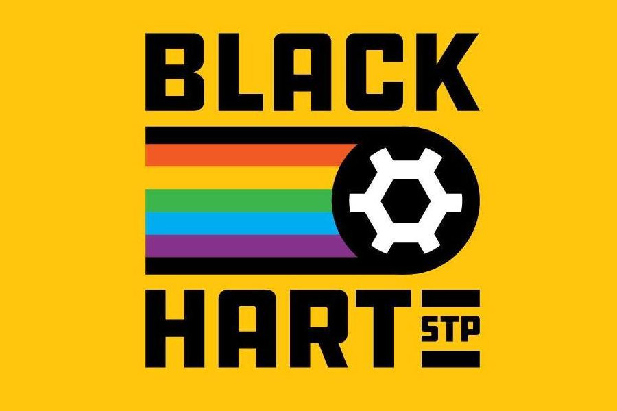 Logo for Black Hart of Saint Paul with pride stripes and a white soccer ball on a yellow background.