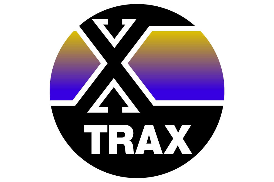 Circular TRAX logo displaying a large black “X”, white lettering, and gold-to-purple gradient panels on a white background.