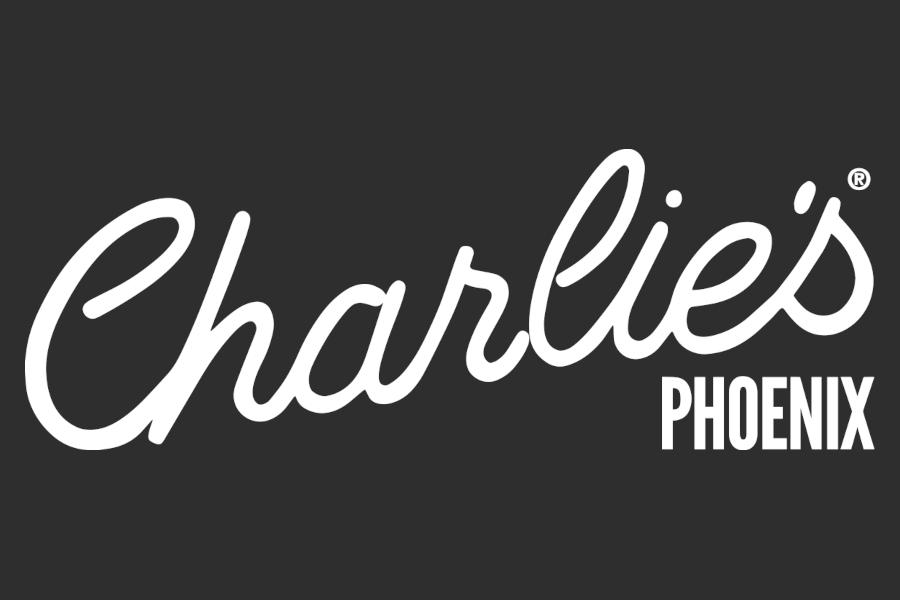 Logo of Charlie’s Phoenix with large flowing white script for Charlie’s and smaller bold uppercase lettering for Phoenix on dark grey.