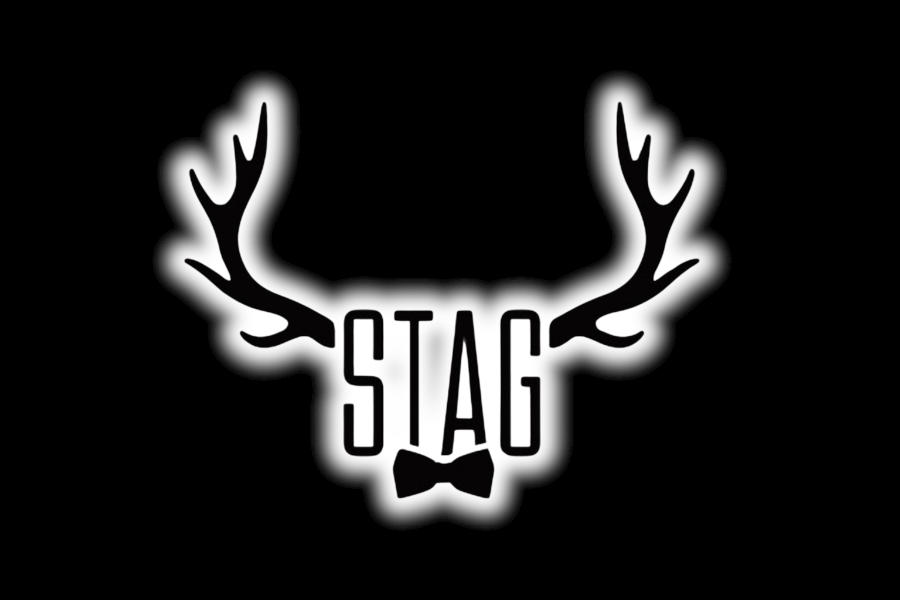 Logo of Stag PDX displaying black antlers, bold vertical lettering, and a bow tie highlighted by a soft white glow.
