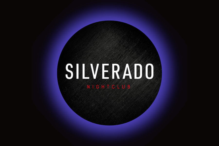 Logo of Silverado featuring white lettering inside a black circular emblem with a purple glow on a black background.