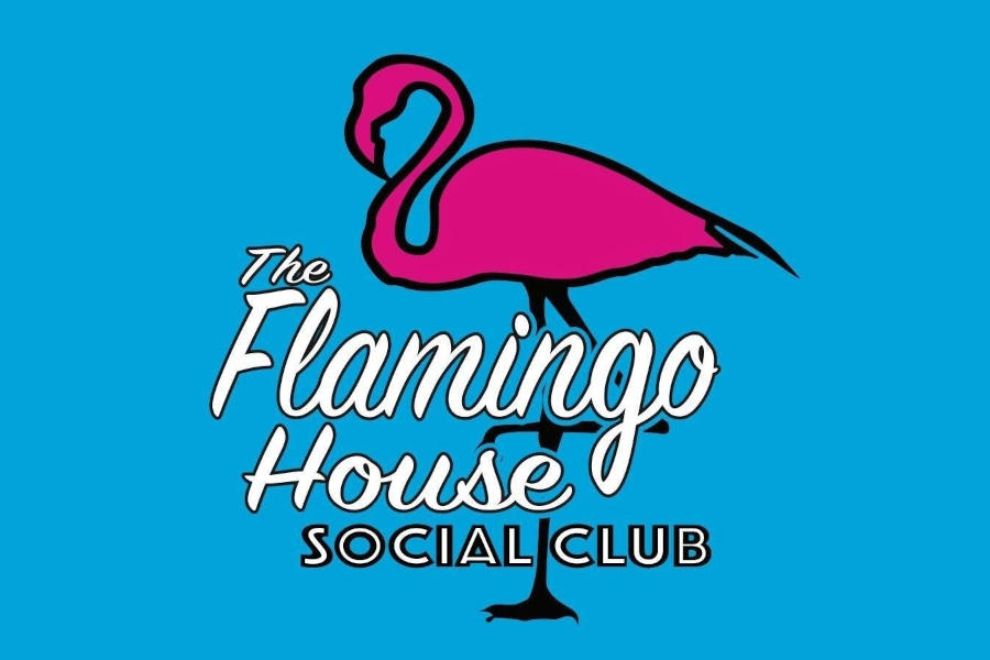 Logo of The Flamingo House displaying a pink flamingo illustration, white handwritten typography, and a bright blue backdrop with a playful tropical esthetic.